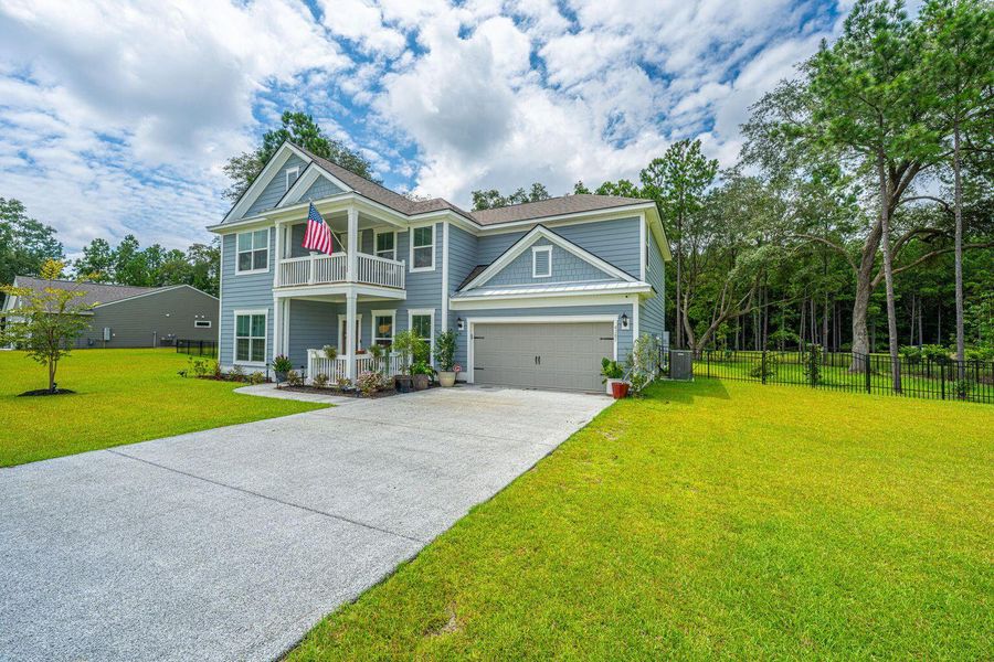 Front exterior of a new home in Sea Island Preserve, Johns Island, SC, highlighting curb appeal (Image 22). Front exterior of a new home in Sea Island Preserve, Johns Island, SC, highlighting curb appeal (Image 22).