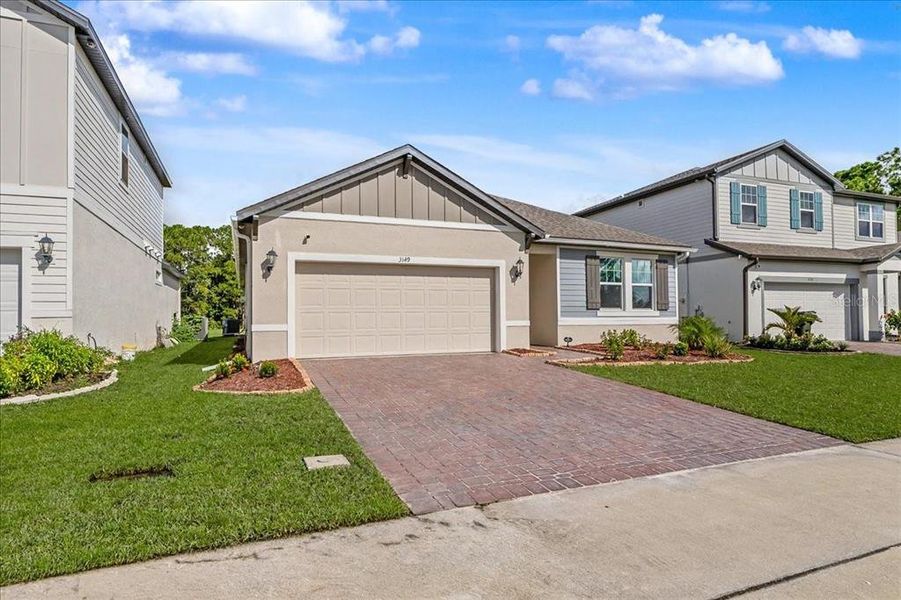 Front exterior of a new home in , Daytona Beach, FL, highlighting curb appeal (Image 26). Front exterior of a new home in , Daytona Beach, FL, highlighting curb appeal (Image 26).
