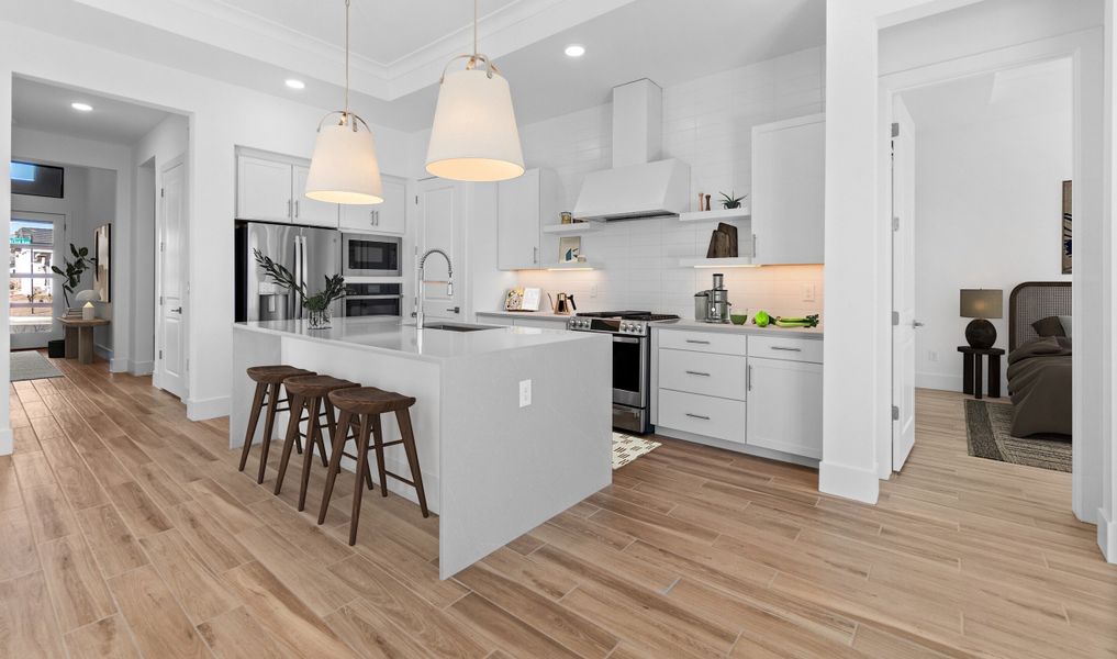 Striking pendant lighting highlights central island