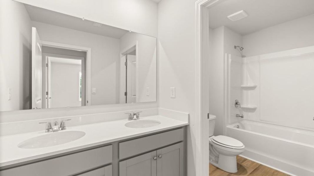 Furnished interior view inside a new home in Fairway 17 at Mirror Lake, Villa Rica (Image 9).