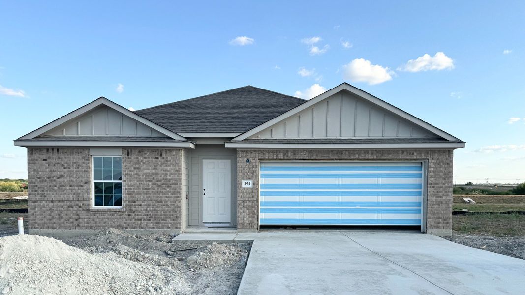 Front exterior of a new home in Sky Ridge, San Marcos, TX, highlighting curb appeal (Image 2). Front exterior of a new home in Sky Ridge, San Marcos, TX, highlighting curb appeal (Image 2).
