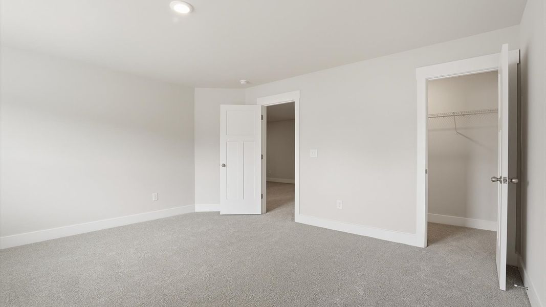 Highly functional bedroom with walk-in closet and tasteful carpet for a restful retreat located in Anderson, SC Highly functional bedroom with walk-in closet and tasteful carpet for a restful retreat located in Anderson, SC