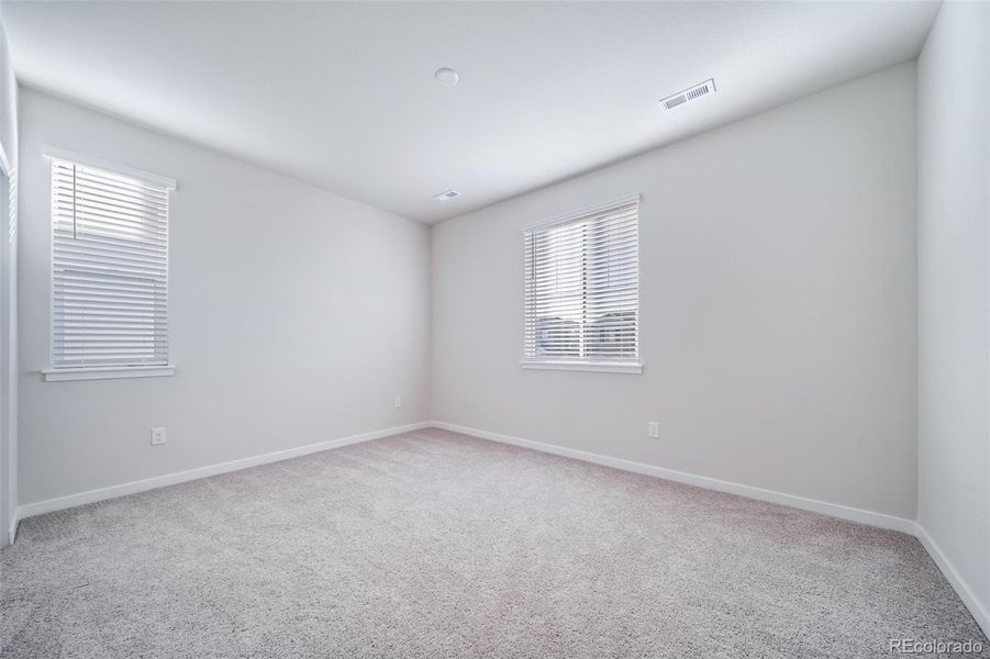 Spacious, unfurnished interior of a new home in Floret Collection at Alder Creek, Parker (Image 32).