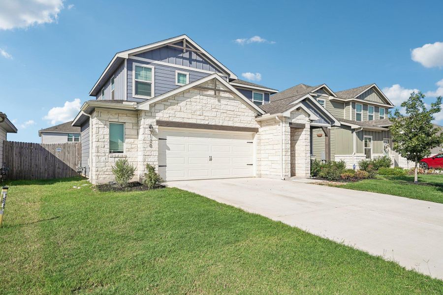 Front exterior of a new home in Waterstone Crossing, Kyle, TX, highlighting curb appeal (Image 18).