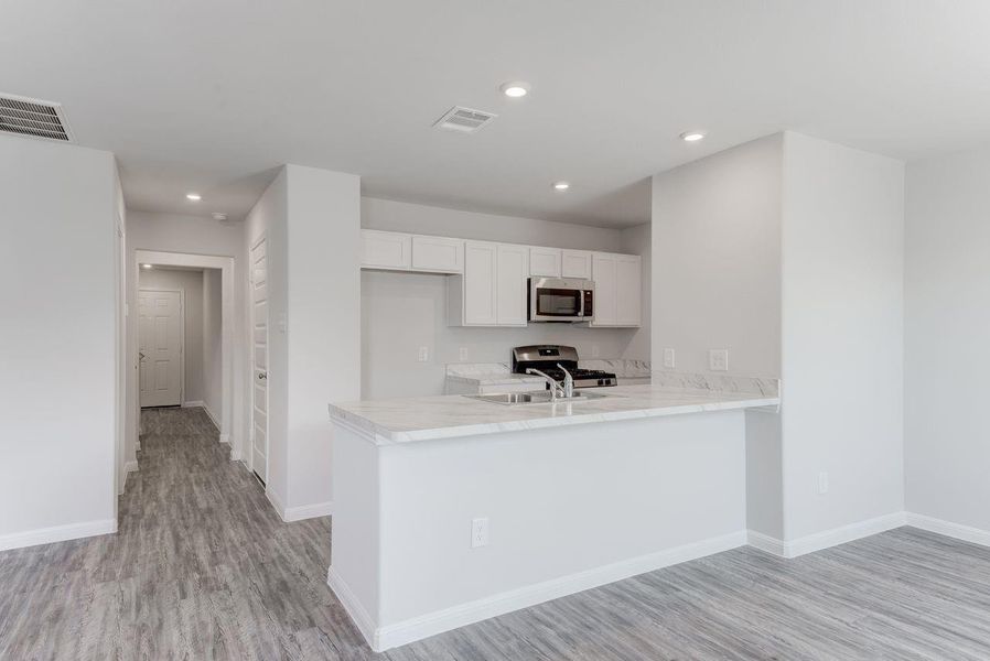 Furnished interior view inside a new home in Pirate's Cove Estates, Vidor (Image 8).