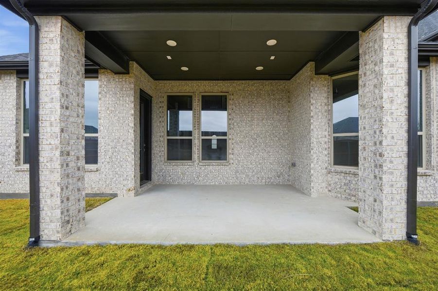 Exterior details and patio area of a home in Wildflower Ranch, Northlake (Image 19).