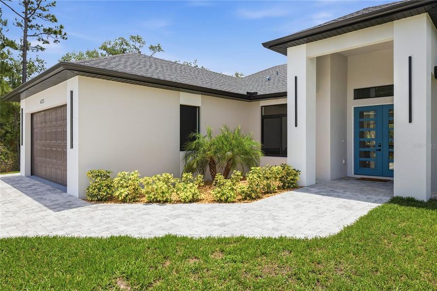 Exterior details and patio area of a home in , North Port (Image 29).