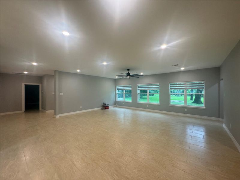 Reverse view of living room, primary bedroom and hallway to the left