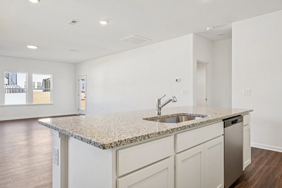 Kitchen - Chic white finishes and smooth surfaces shine.