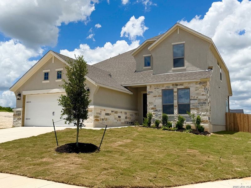 Front exterior of a new home in Ladera - 50s, San Antonio, TX, highlighting curb appeal (Image 2). Front exterior of a new home in Ladera - 50s, San Antonio, TX, highlighting curb appeal (Image 2).