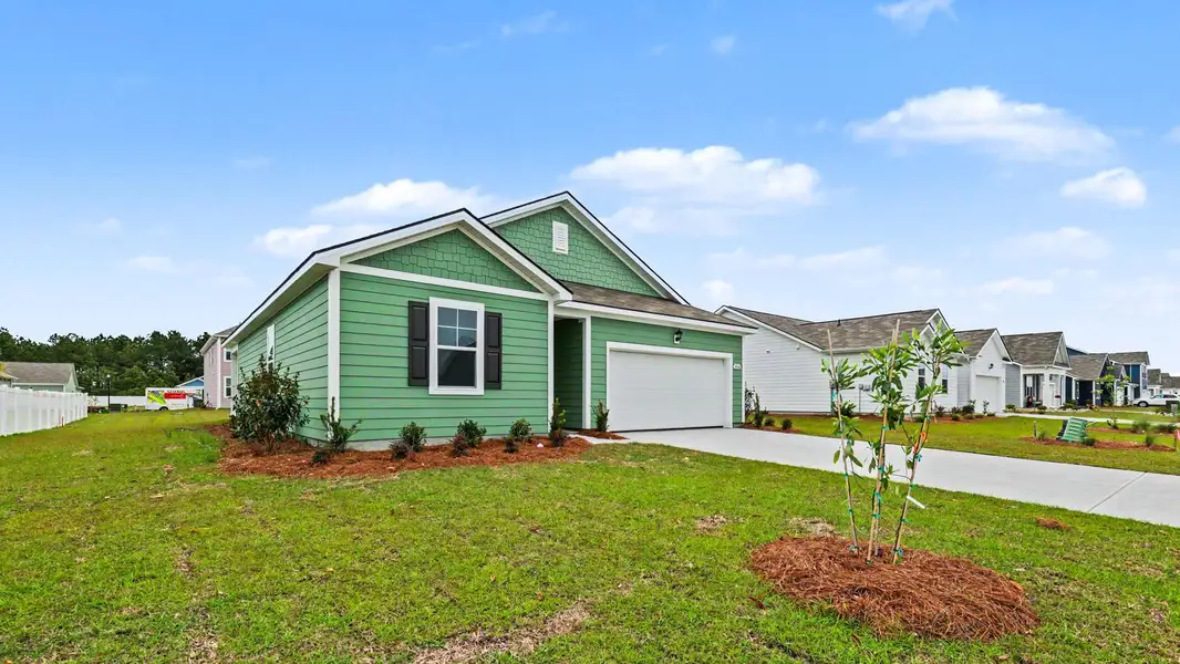 Front exterior of a new home in Auberon Woods, Conway, SC, highlighting curb appeal (Image 2). Front exterior of a new home in Auberon Woods, Conway, SC, highlighting curb appeal (Image 2).