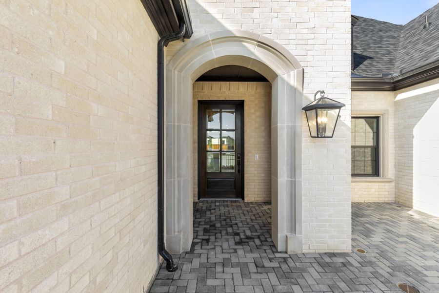 Representative exterior details of a home built from the 5521 by Tradition Homes in Windsong Ranch, Prosper (Image 4).