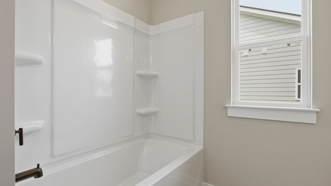 Bathroom with shower and window Bathroom with shower and window
