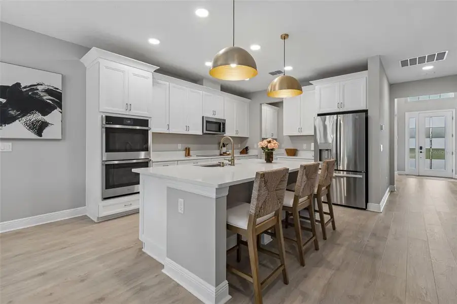 Furnished interior view inside a new home in Whispering Oaks Preserve, Wesley Chapel (Image 5).