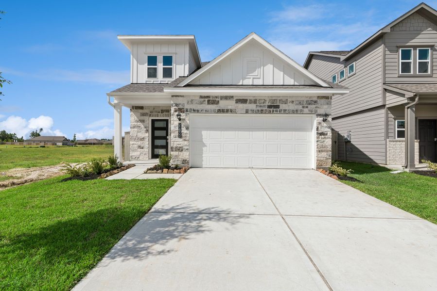 Front exterior of a new home in The Canopies, Splendora, TX, highlighting curb appeal (Image 1). Front exterior of a new home in The Canopies, Splendora, TX, highlighting curb appeal (Image 1).