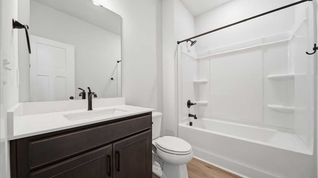 Vibrant and welcoming bathroom with elegant countertop space and polished details located at Iris Meadows