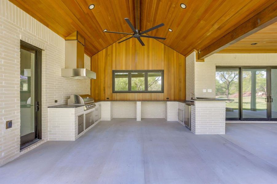 View of patio / terrace with an outdoor kitchen and ceiling fan