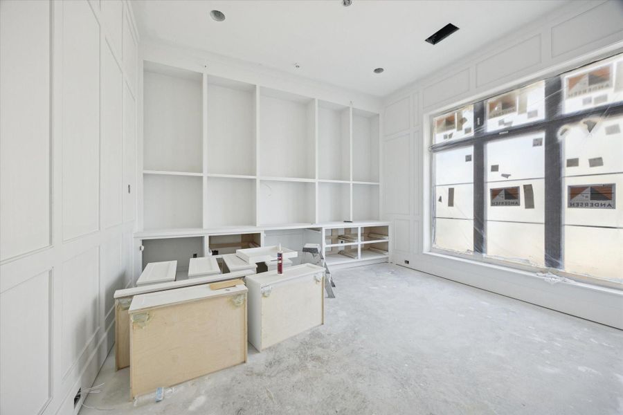 Downstairs home office/study with paneled walls. Pictured February 2026.