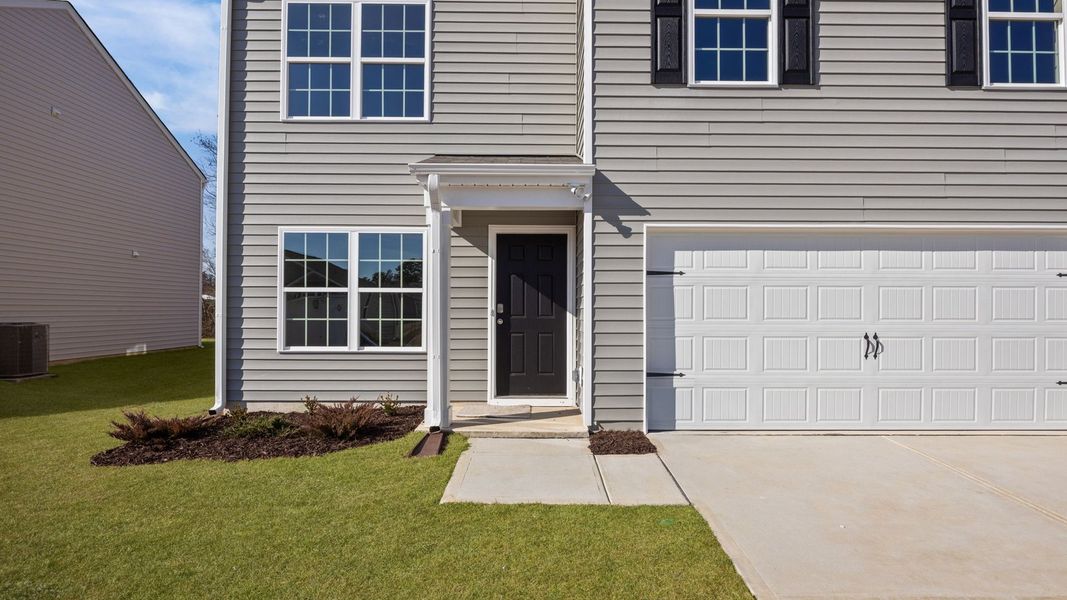 Exterior details and patio area of a home in Madeline Farm, New Bern (Image 4).
