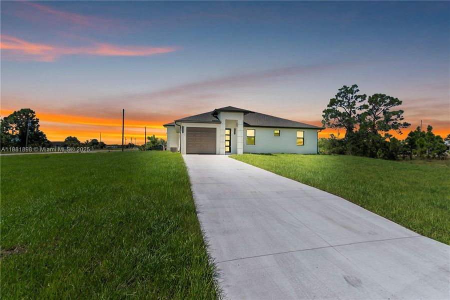 Front exterior of a new home in , Lehigh Acres, FL, highlighting curb appeal (Image 2).