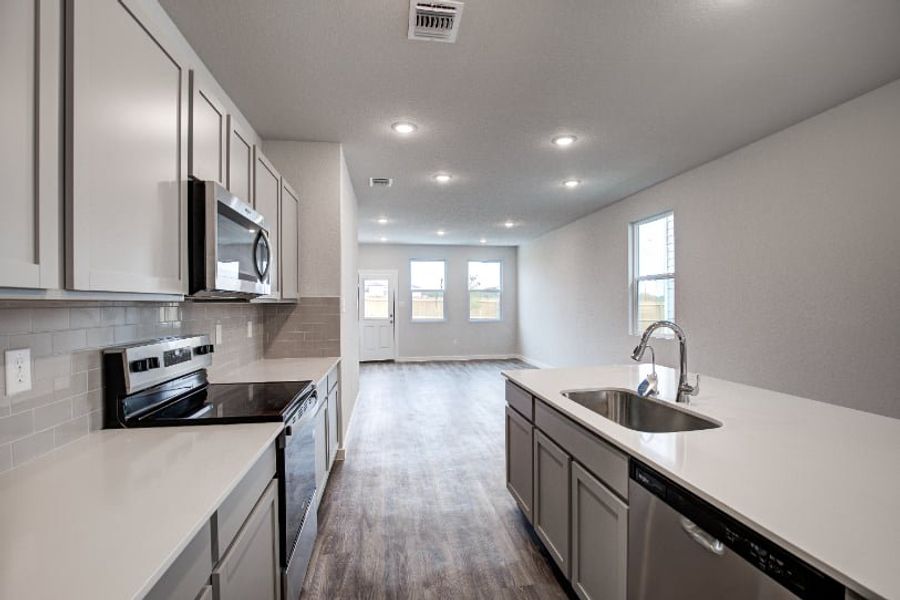 A kitchen with white cabinets. A kitchen with white cabinets.