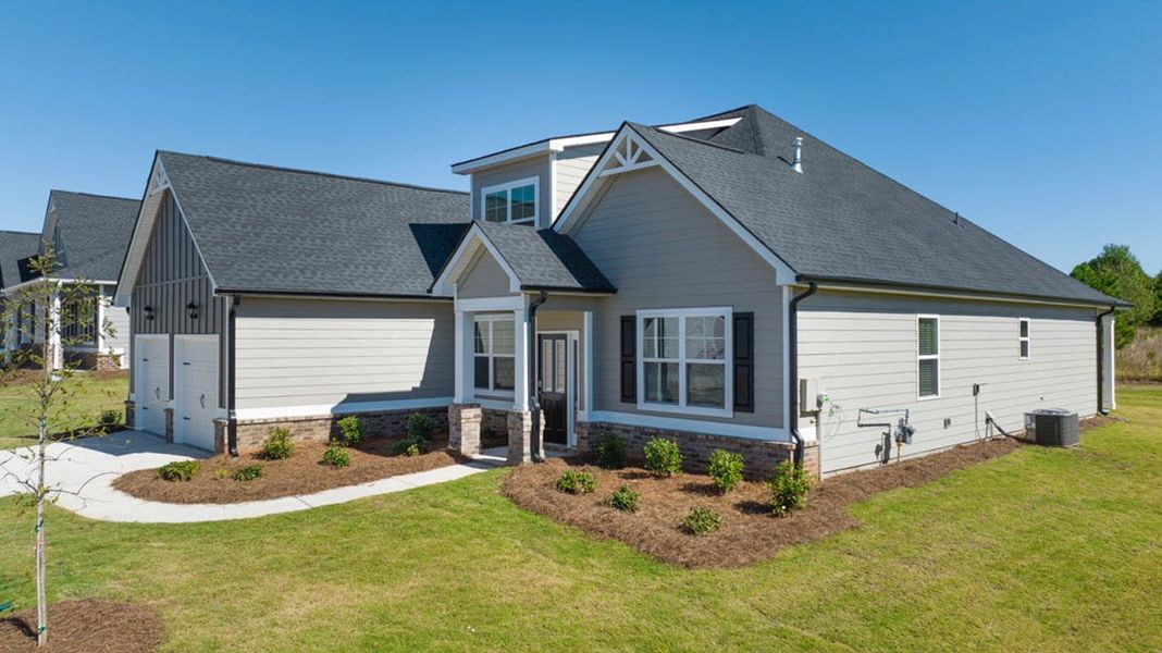 Front exterior of a new home in The Gates at Pates Creek, Hampton, GA, highlighting curb appeal (Image 15).