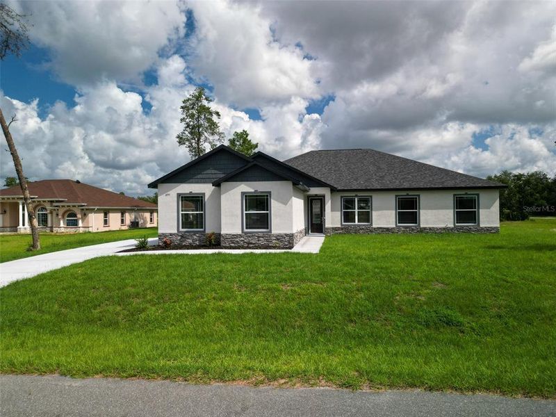 Front exterior of a new home in , Ocala, FL, highlighting curb appeal (Image 30). Front exterior of a new home in , Ocala, FL, highlighting curb appeal (Image 30).