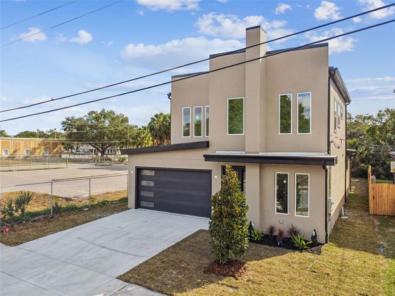 Front exterior of a new home in , Tampa, FL, highlighting curb appeal (Image 30).
