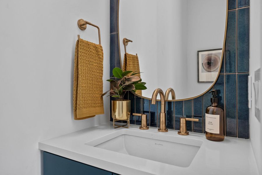 Powder/guest bathroom featuring designer finishes, Ann Sacks tile backsplash, color matched custom cabinetry Powder/guest bathroom featuring designer finishes, Ann Sacks tile backsplash, color matched custom cabinetry