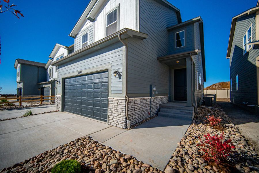 Representative exterior photo of a completed home built from the Manitou by View Homes in Aspen Meadows – Townhomes, Colorado Springs, CO (Image 2). Representative exterior photo of a completed home built from the Manitou by View Homes in Aspen Meadows – Townhomes, Colorado Springs, CO (Image 2).