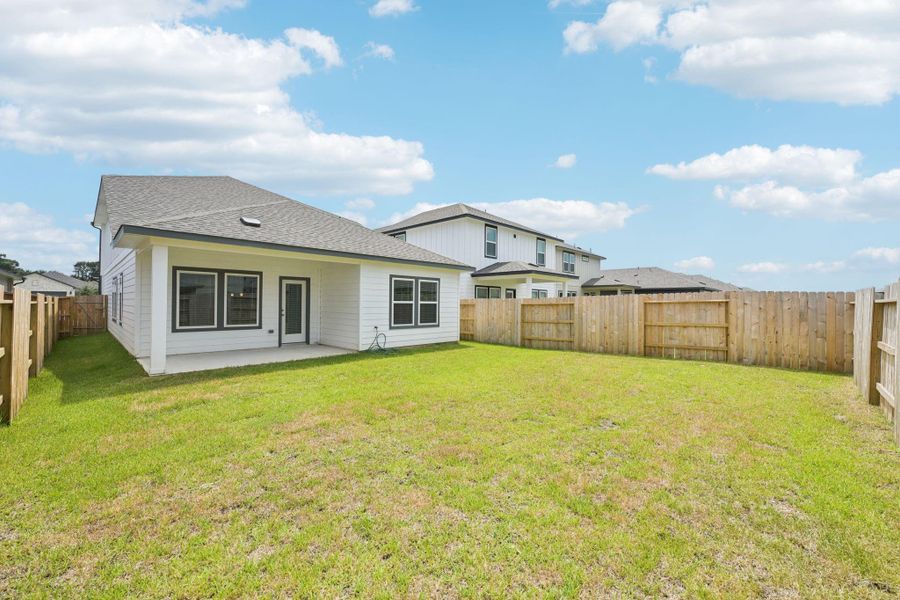 Front exterior of a new home in Mavera, Conroe, TX, highlighting curb appeal (Image 19). Front exterior of a new home in Mavera, Conroe, TX, highlighting curb appeal (Image 19).