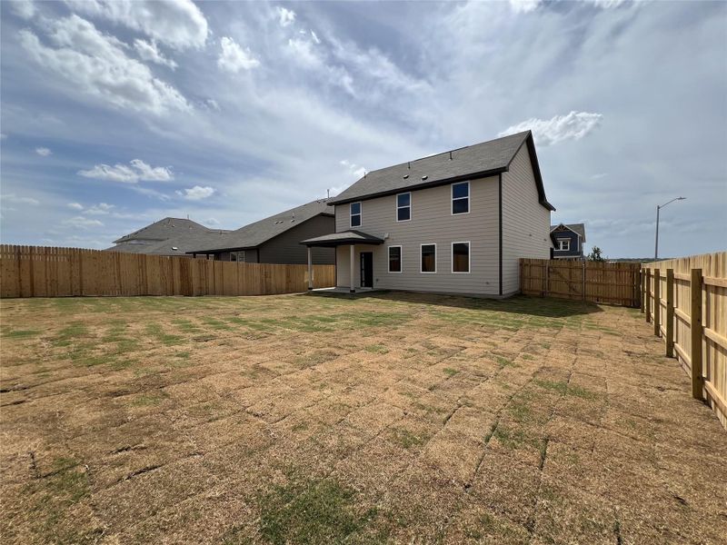 Front exterior of a new home in Rolling Glen, Hutto, TX, highlighting curb appeal (Image 14). Front exterior of a new home in Rolling Glen, Hutto, TX, highlighting curb appeal (Image 14).