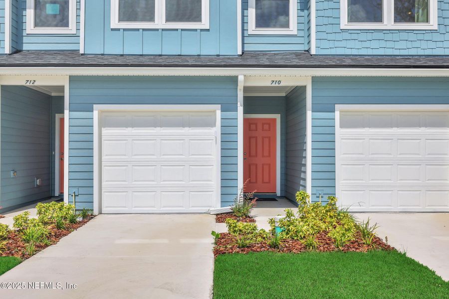 Front exterior of a new home in Kasen Oaks, Jacksonville, FL, highlighting curb appeal (Image 18).