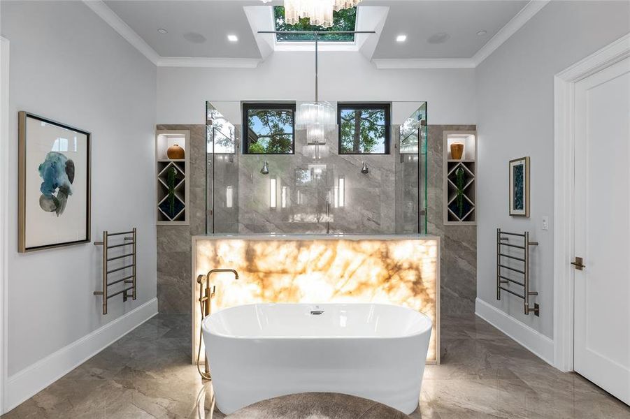 Bathroom with crown molding, a notable chandelier, and shower with separate bathtub