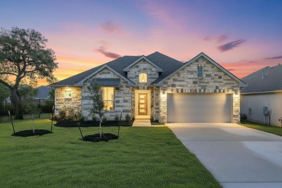 Stone facade home featuring an attached garage, landscaped lawn, mature trees, and a concrete driveway Stone facade home featuring an attached garage, landscaped lawn, mature trees, and a concrete driveway