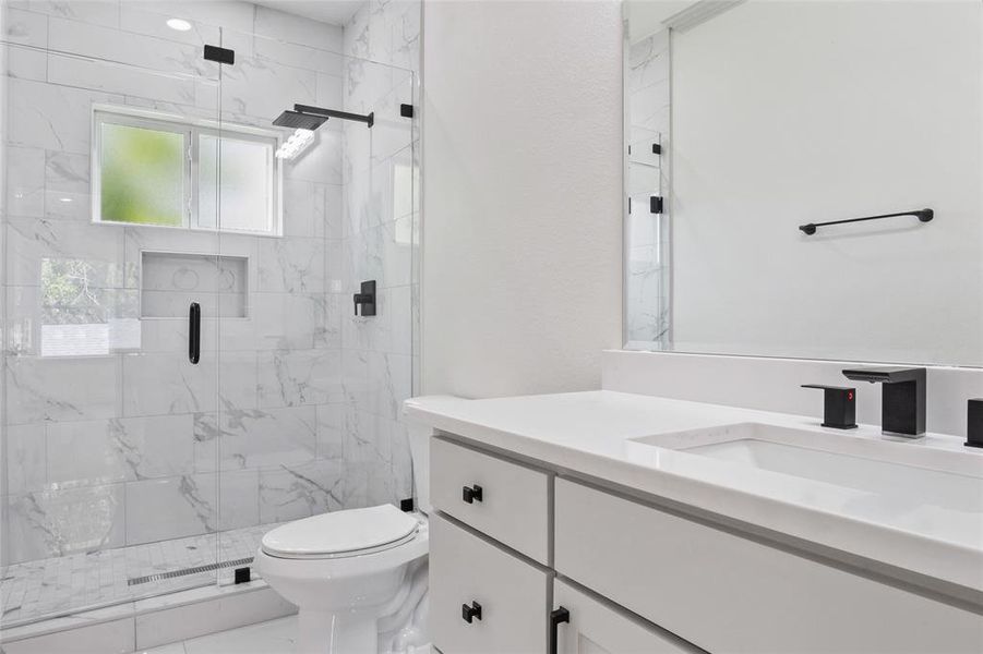 Full bathroom with vanity and finish shower Full bathroom with vanity and finish shower