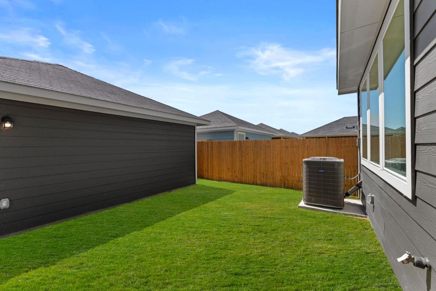 Exterior details and patio area of a home in Valverde, Bastrop (Image 21).