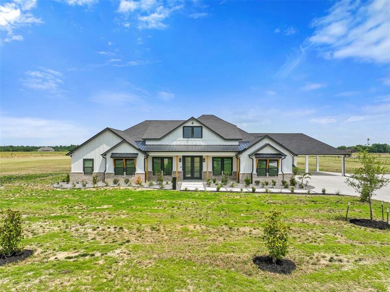 Front exterior of a new home in , Ennis, TX, highlighting curb appeal (Image 27).