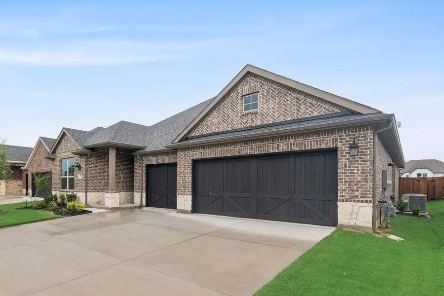 Front exterior of a new home in Sutton Fields, Celina, TX, highlighting curb appeal (Image 2). Front exterior of a new home in Sutton Fields, Celina, TX, highlighting curb appeal (Image 2).