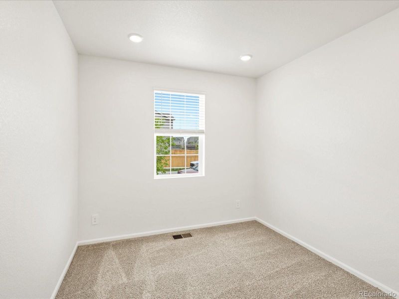 Spacious, unfurnished interior of a new home in Ridgeline Vista: The Flora Collection, Brighton (Image 22).