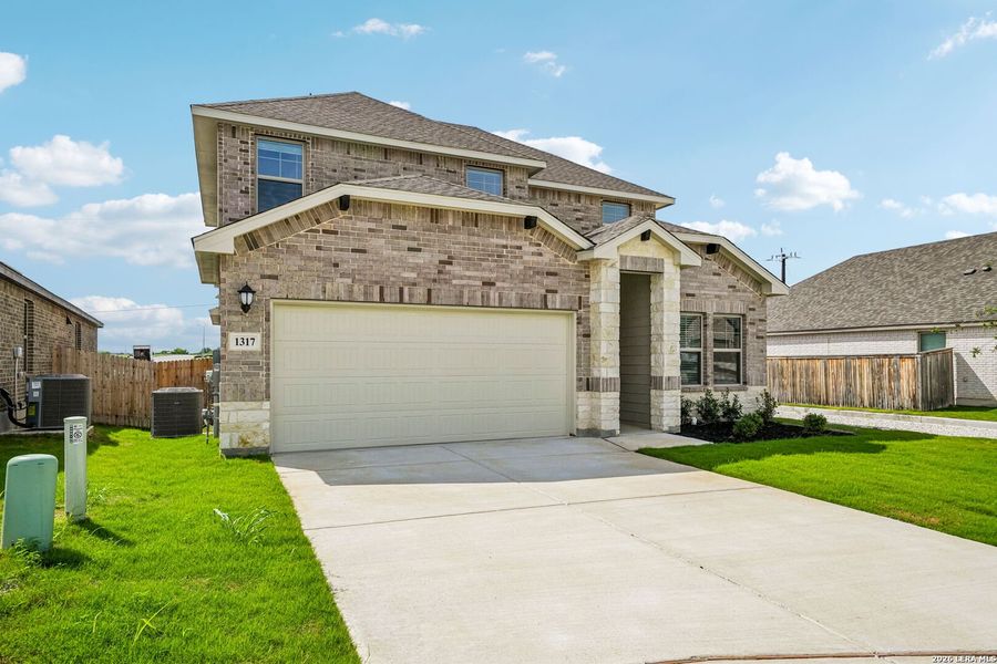 Front exterior of a new home in Arcadia Ridge - Premier Series, San Antonio, TX, highlighting curb appeal (Image 28).