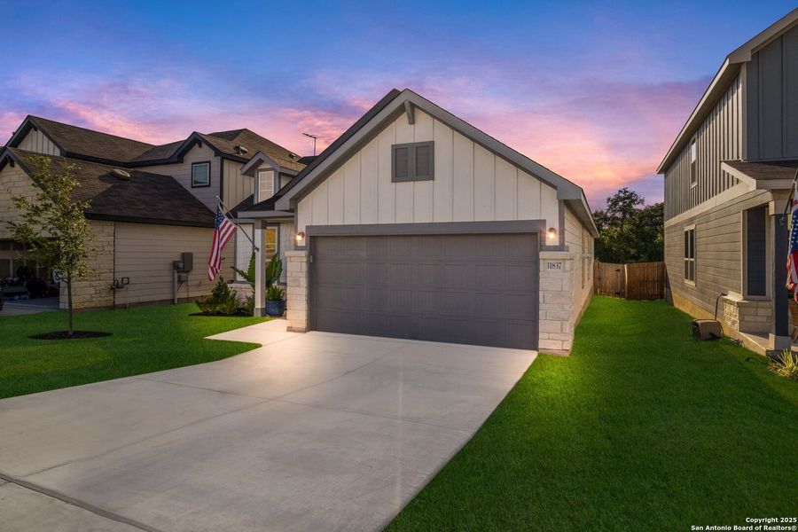 Front exterior of a new home in Davis Ranch, San Antonio, TX, highlighting curb appeal (Image 21).