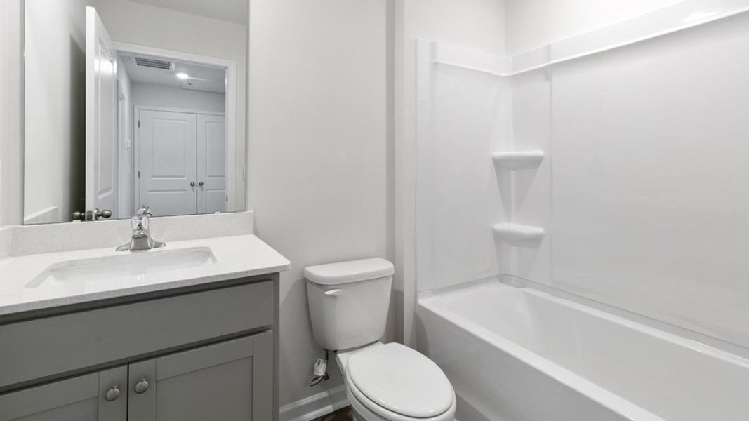 Furnished interior view inside a new home in The Townes at Bexford, Willow Spring (Image 5).