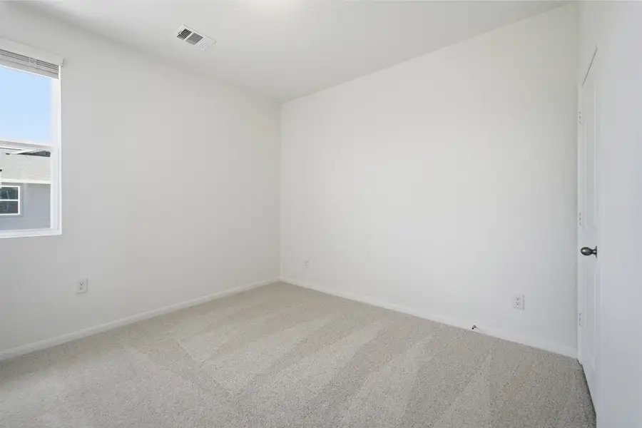 Representative unfurnished interior of a home built from the Kahn by CastleRock Communities in Municipal Drive Townhomes, Leander (Image 21).