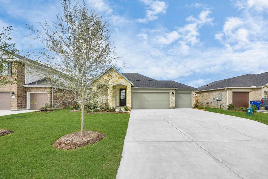 Front exterior of a new home in Sunrise Cove: Landmark Collection, Texas City, TX, highlighting curb appeal (Image 2).