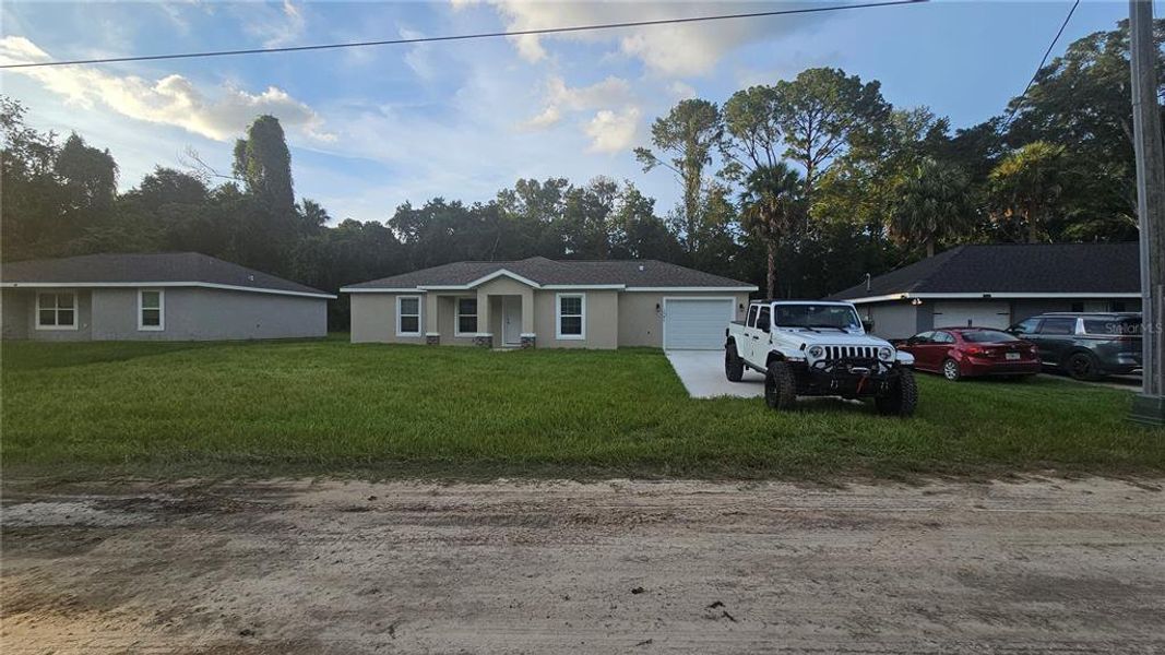 Front exterior of a new home in , Belleview, FL, highlighting curb appeal (Image 16).