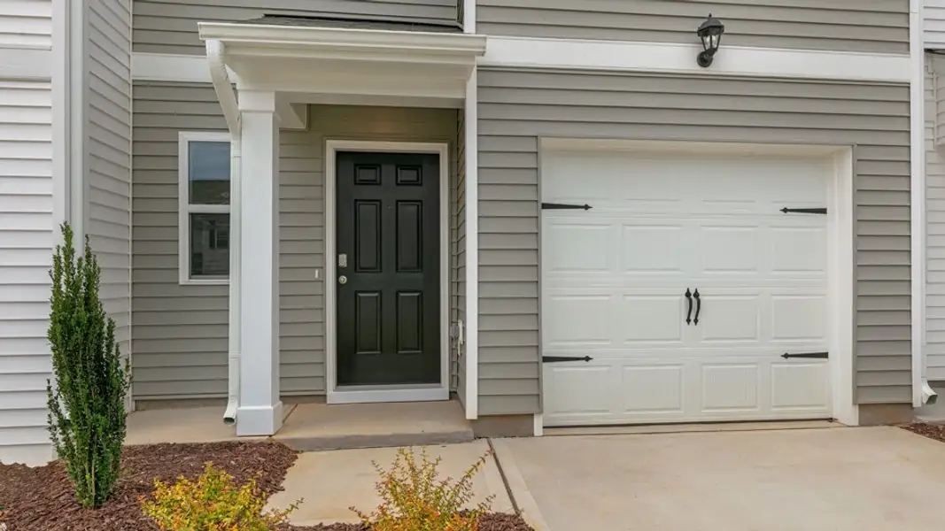 Exterior details and patio area of a home in The Townes at Hunter Hill, Rocky Mount (Image 3).