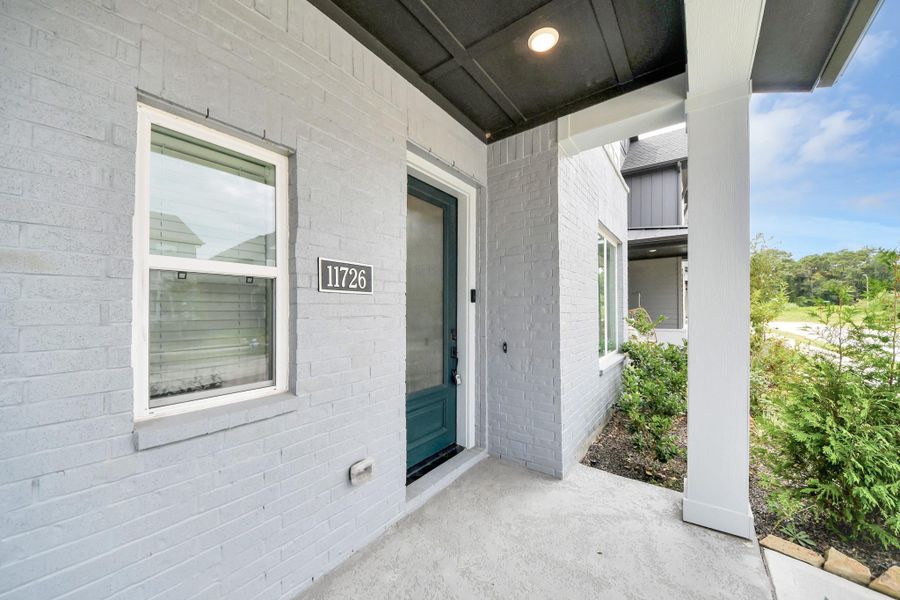Exterior details and patio area of a home in The Groves 35', Humble (Image 31). Exterior details and patio area of a home in The Groves 35', Humble (Image 31).