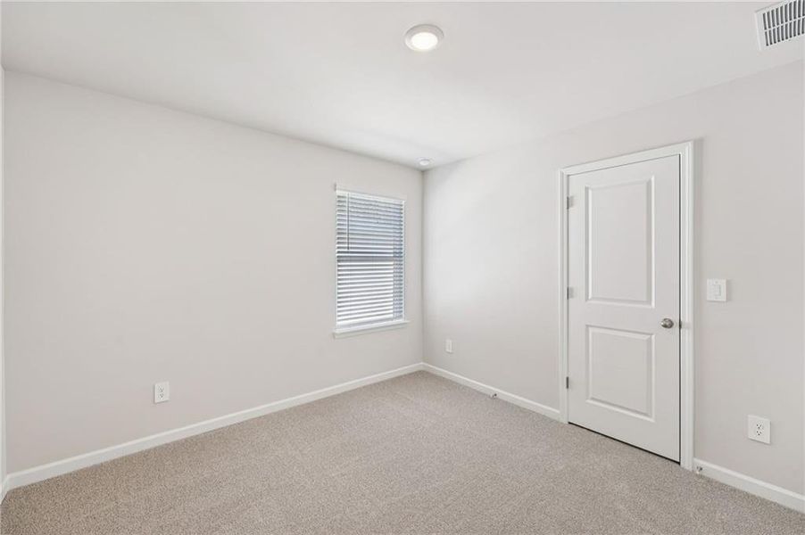 Spacious, unfurnished interior of a new home in Creekside at Oxford Park, Fairburn (Image 39).