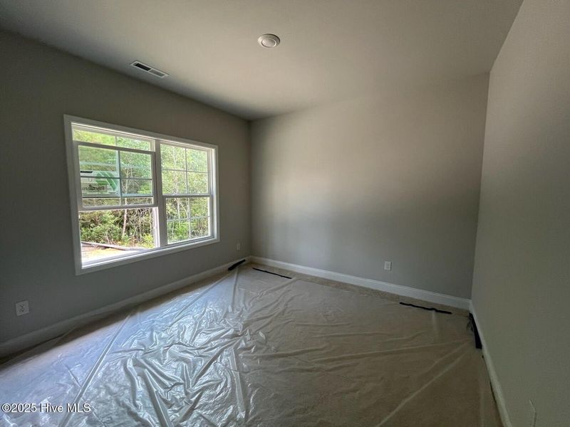 Spacious, unfurnished interior of a new home in Palmetto Creek, Bolivia (Image 9).